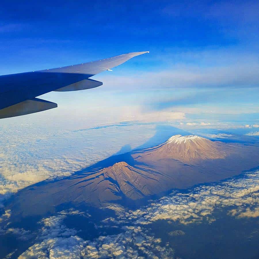 fly to climb Kilimanjaro